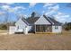 Spacious backyard with a screened porch, hot tub, grill and well-maintained lawn perfect for outdoor enjoyment at 560 Waterstone Ln, Henderson, NC 27537