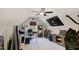 Bright bonus room featuring a ceiling fan, neutral carpet, and decor making it perfect for a home office or gym at 560 Waterstone Ln, Henderson, NC 27537