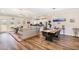 Spacious open-concept living room and kitchen area with hardwood floors and plenty of seating at 560 Waterstone Ln, Henderson, NC 27537