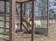 Fenced animal pen containing multiple sheep, with sparse greenery and wooded surroundings at 577 Dixon Rd # D, Willow Springs, NC 27592