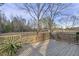 Expansive backyard with a spacious wooden deck and lush greenery, perfect for outdoor activities and relaxation at 577 Dixon Rd # D, Willow Springs, NC 27592