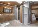 Well-appointed bathroom featuring a walk-in shower, gray walls, wooden accents, and wood ceiling at 577 Dixon Rd # D, Willow Springs, NC 27592