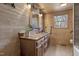 Rustic bathroom with wood paneling, a decorative mirror, and a charming vanity at 577 Dixon Rd # D, Willow Springs, NC 27592