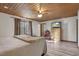 Comfortable bedroom featuring a wood ceiling, window, and tasteful decor, creating a serene and inviting atmosphere at 577 Dixon Rd # D, Willow Springs, NC 27592