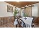 Dining area with a sliding barn door and decorative shelving on the adjacent wall at 577 Dixon Rd # D, Willow Springs, NC 27592