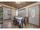 Charming dining room with a sliding barn door and natural light from surrounding windows at 577 Dixon Rd # D, Willow Springs, NC 27592
