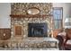 Stone fireplace with wooden mantel creating a cozy focal point in the living room at 577 Dixon Rd # D, Willow Springs, NC 27592