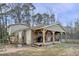Welcoming covered front porch with wooden posts and rustic decor elements at 577 Dixon Rd # D, Willow Springs, NC 27592