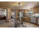 Charming kitchen with wood cabinetry, stainless steel appliances, and an adjacent dining area at 577 Dixon Rd # D, Willow Springs, NC 27592