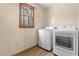 Functional laundry room with natural light and modern washer and dryer at 577 Dixon Rd # D, Willow Springs, NC 27592
