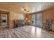 Cozy living room with natural wood walls, a piano, and french doors leading to the outside at 577 Dixon Rd # D, Willow Springs, NC 27592