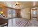 Warm and inviting living room with natural wood walls, French doors, and a cozy rocking chair at 577 Dixon Rd # D, Willow Springs, NC 27592