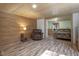 Inviting living area features wood-style flooring, seating, and access to the bedroom at 577 Dixon Rd # D, Willow Springs, NC 27592