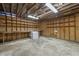 Interior view of a storage area with wooden walls and shelves, with exposed ceiling framing at 577 Dixon Rd # D, Willow Springs, NC 27592