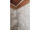 Close-up of a stylishly tiled shower with a pebbled floor and a shower head at 577 Dixon Rd # D, Willow Springs, NC 27592