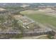 Attractive country home with blooming trees on sprawling grounds, bordered by woodlands and fertile fields at 582 Ebenezer Church Rd, Coats, NC 27521