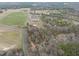 Desirable property with a well-maintained home, green fields, and mature trees, providing an idyllic retreat at 582 Ebenezer Church Rd, Coats, NC 27521