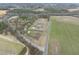 Idyllic farmhouse with mature trees and bordered by state highway and open fields at 582 Ebenezer Church Rd, Coats, NC 27521