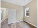 Bedroom featuring a window for natural light and an open doorway to an adjacent space at 582 Ebenezer Church Rd, Coats, NC 27521