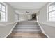 Entryway features the staircase leading to the living room with stone fireplace at 582 Ebenezer Church Rd, Coats, NC 27521