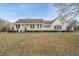 Inviting home featuring a welcoming front porch and meticulously maintained landscaping at 582 Ebenezer Church Rd, Coats, NC 27521
