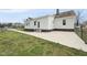 Back exterior view of a house with a long driveway and green lawn at 582 Ebenezer Church Rd, Coats, NC 27521
