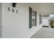 Close up of the exterior showing the house number, white siding, and green shutters at 582 Ebenezer Church Rd, Coats, NC 27521