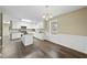 Bright and airy kitchen with white cabinets, granite countertops, and an island at 582 Ebenezer Church Rd, Coats, NC 27521
