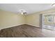 Bright living room with hardwood floors and sliding glass doors for natural light and outdoor access at 582 Ebenezer Church Rd, Coats, NC 27521