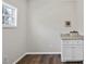Room with granite countertop, white cabinets, and window with a small space for storage at 582 Ebenezer Church Rd, Coats, NC 27521