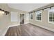 Bright sunroom with multiple windows offering ample natural light and scenic outdoor views at 582 Ebenezer Church Rd, Coats, NC 27521