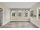 Bright sunroom with multiple windows offering ample natural light and scenic outdoor views at 582 Ebenezer Church Rd, Coats, NC 27521