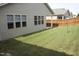 Backyard featuring a well maintained lawn and wood fence at 8504 Lasilla Way, Raleigh, NC 27616