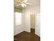 Bedroom with wood floors and a window with a valance and a closet in view at 8504 Lasilla Way, Raleigh, NC 27616