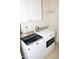 Convenient laundry room boasts a modern washer and dryer set and ample storage space at 8504 Lasilla Way, Raleigh, NC 27616