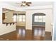 Open-concept living area with hardwood floors, a breakfast bar, and a view into the dining room at 8504 Lasilla Way, Raleigh, NC 27616