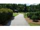 Landscaped park path leading to a gazebo with mature trees and manicured greenery at 8504 Lasilla Way, Raleigh, NC 27616
