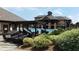 Community pool with lounge chairs and a clubhouse in the background at 8504 Lasilla Way, Raleigh, NC 27616