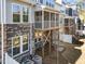 Exterior view of the back of the building showcasing decks and outdoor space at 8620 Secreto Dr, Raleigh, NC 27606