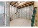 Unfinished basement showcasing the wall construction and concrete floor at 8620 Secreto Dr, Raleigh, NC 27606