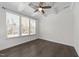 Bedroom featuring coffered ceilings, a ceiling fan, and natural light from large windows with blinds at 8620 Secreto Dr, Raleigh, NC 27606