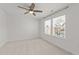 Spacious, carpeted bedroom featuring a ceiling fan and two windows at 8620 Secreto Dr, Raleigh, NC 27606