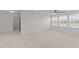 Large carpeted bonus room with ceiling fan and three windows at 8620 Secreto Dr, Raleigh, NC 27606