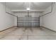 Clean and spacious two car garage with concrete flooring and neutral walls at 8620 Secreto Dr, Raleigh, NC 27606