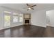 Living room featuring a stone fireplace, access to outdoor space, and neutral walls, offering a cozy atmosphere at 8620 Secreto Dr, Raleigh, NC 27606