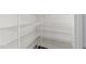 Walk-in pantry featuring multiple shelves for ample storage, offering organized storage solutions at 8620 Secreto Dr, Raleigh, NC 27606
