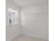 Walk-in closet featuring a window, carpeting and wire shelving at 8620 Secreto Dr, Raleigh, NC 27606