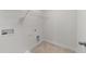 Walk-in closet with white walls, tile floor, wire shelving and utility connections at 8620 Secreto Dr, Raleigh, NC 27606
