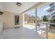 Charming covered back porch with seating area overlooking backyard and pond at 902 Zion Church Rd, Sanford, NC 27330
