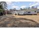 Spacious backyard features a long deck with railings, perfect for outdoor enjoyment at 902 Zion Church Rd, Sanford, NC 27330